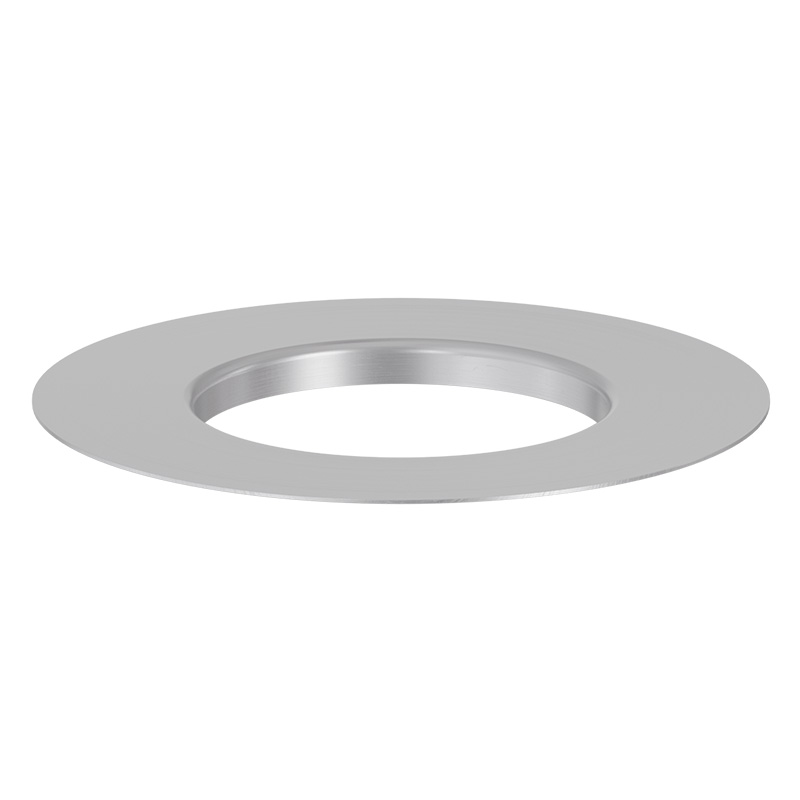 Une scène accueillante avec une plaque en acier inoxydable avec un trou circulaire, mise en valeur par la présence de l'anneau 00704 SPIN 1500 Eco.