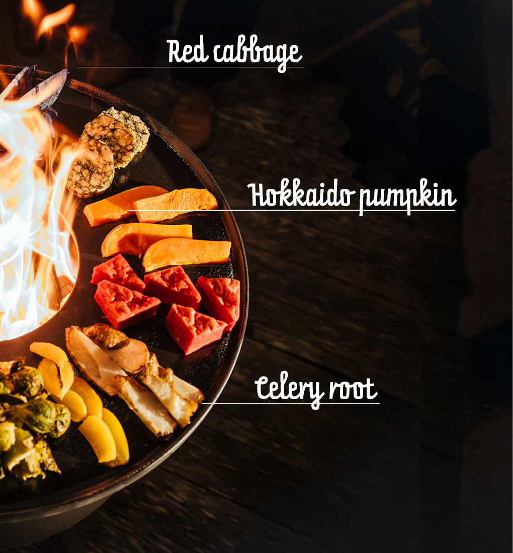 A depiction of a bowl of food with a fire in the background