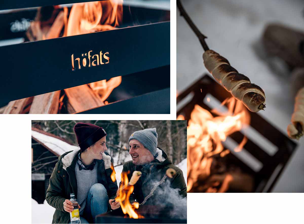 The photo presents a couple is sitting by a fire and drinking wine, with the SPIN 120 Table Fire silver.