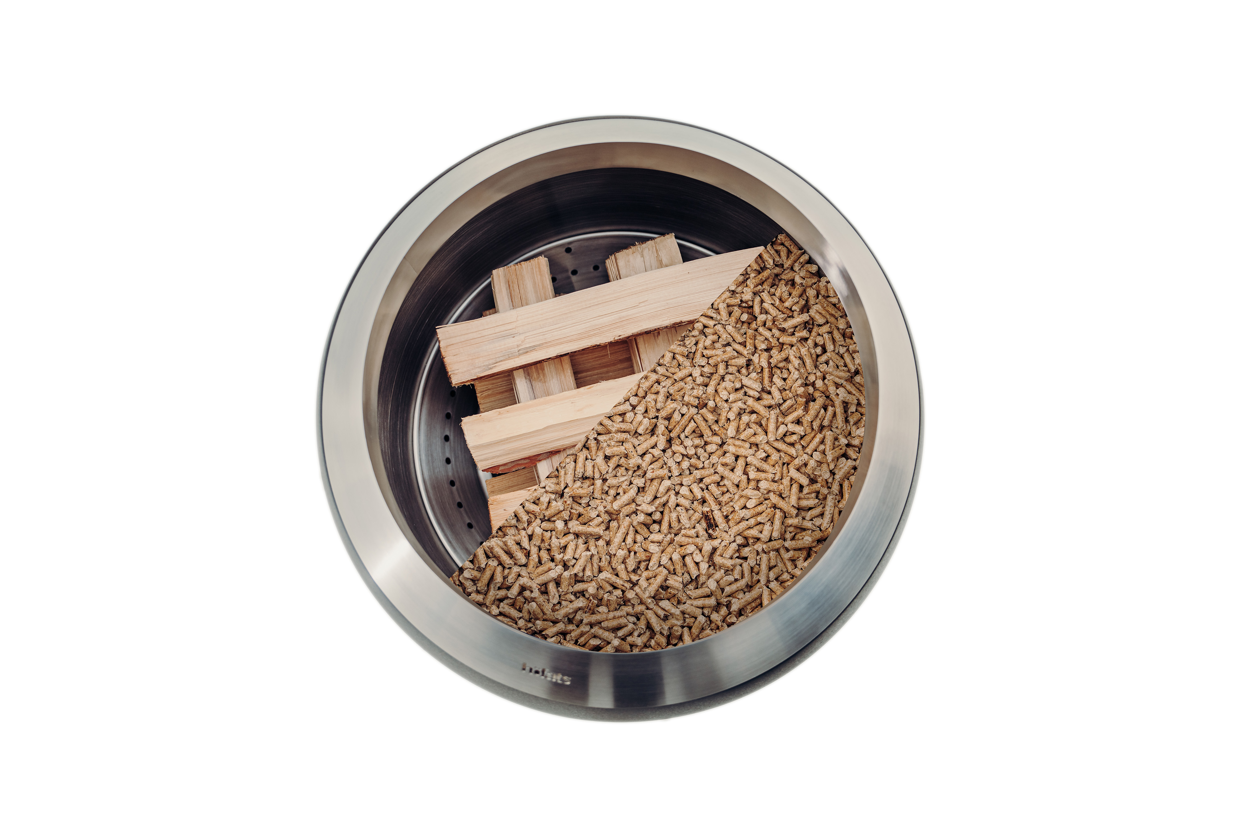 A MOON 45 from above, filled with wood chips and logs showing the two different ways to light up the Firebasket