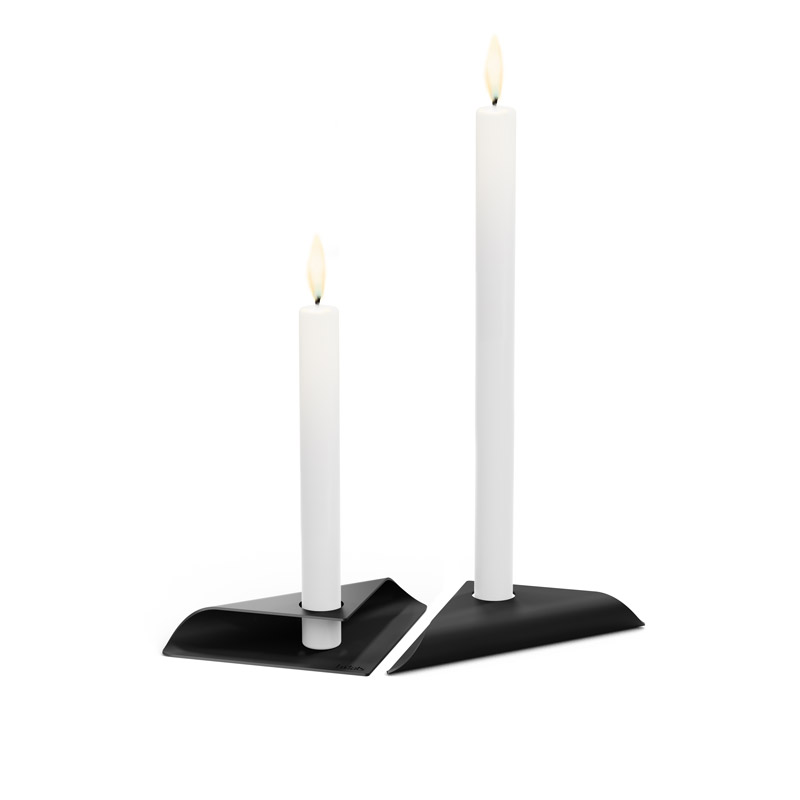 SQUARE CANDLE Candleholder black The photo presents two white candles on a black stand, with the SQUARE CANDLE Candleholder black.