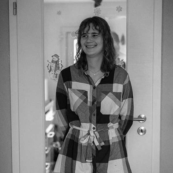 a woman standing in front of a door