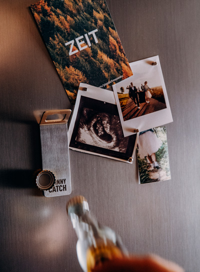 Illustrated is a person holding a glass of wine, with the JOHNNY CATCH Magnet.