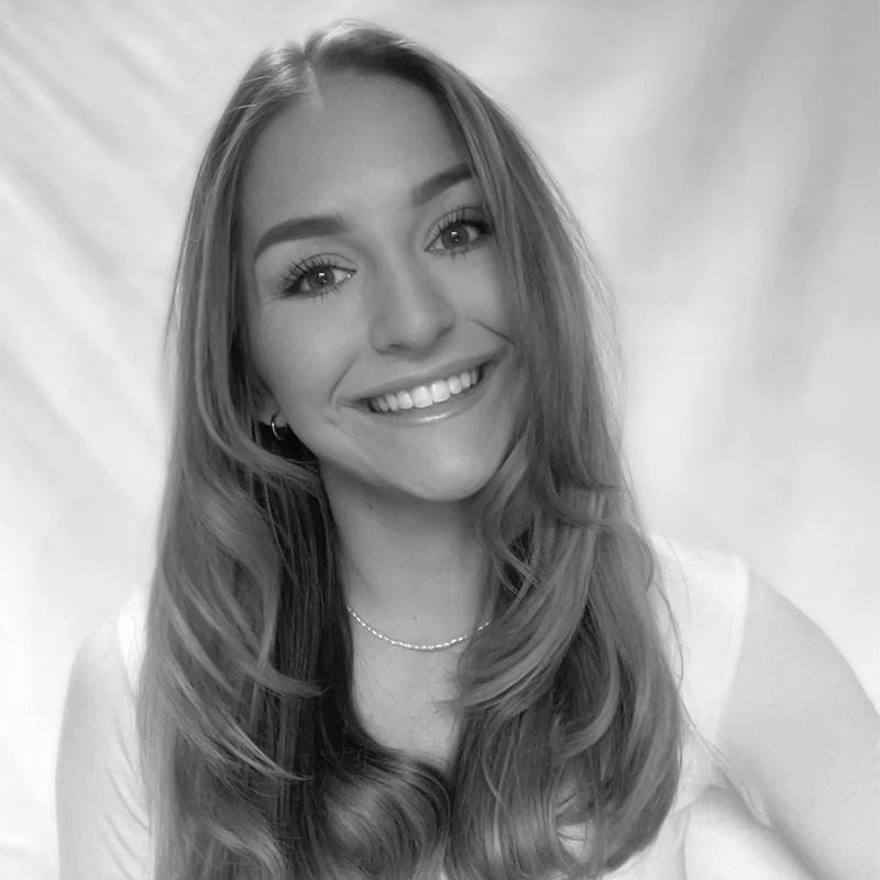 a woman with long hair and a white shirt