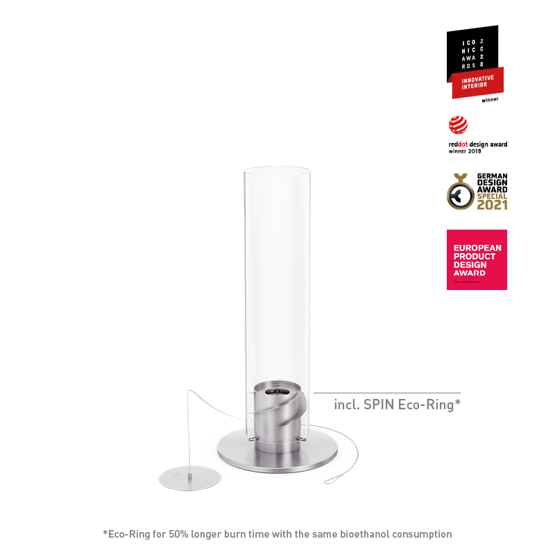 SPIN classic 900 Cheminée de Table argent La photo présente un poteau en verre blanc et en métal avec une base argentée, avec le brasero de table SPIN 900 en argent.