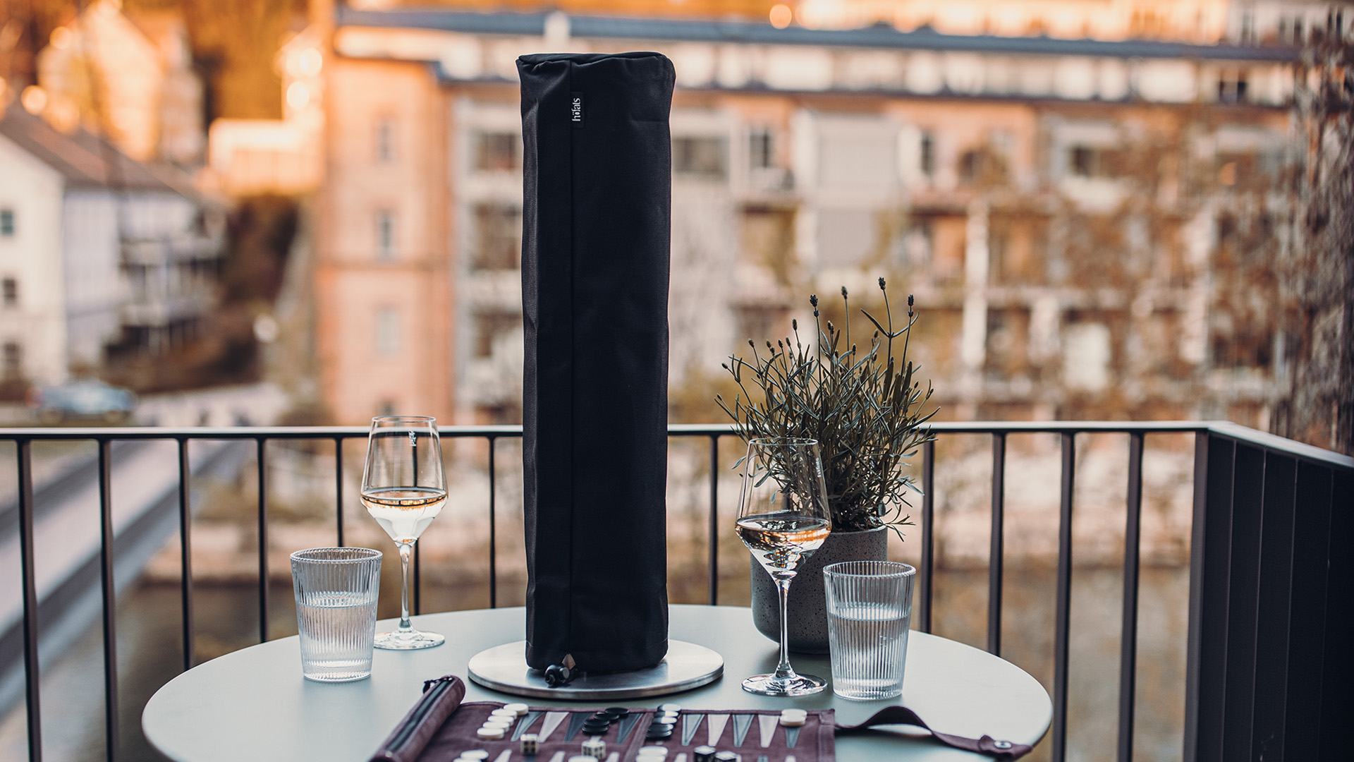 An inviting scene with a table with a wine bottle and two glasses on it, highlighted by the presence of the Spin Cover.