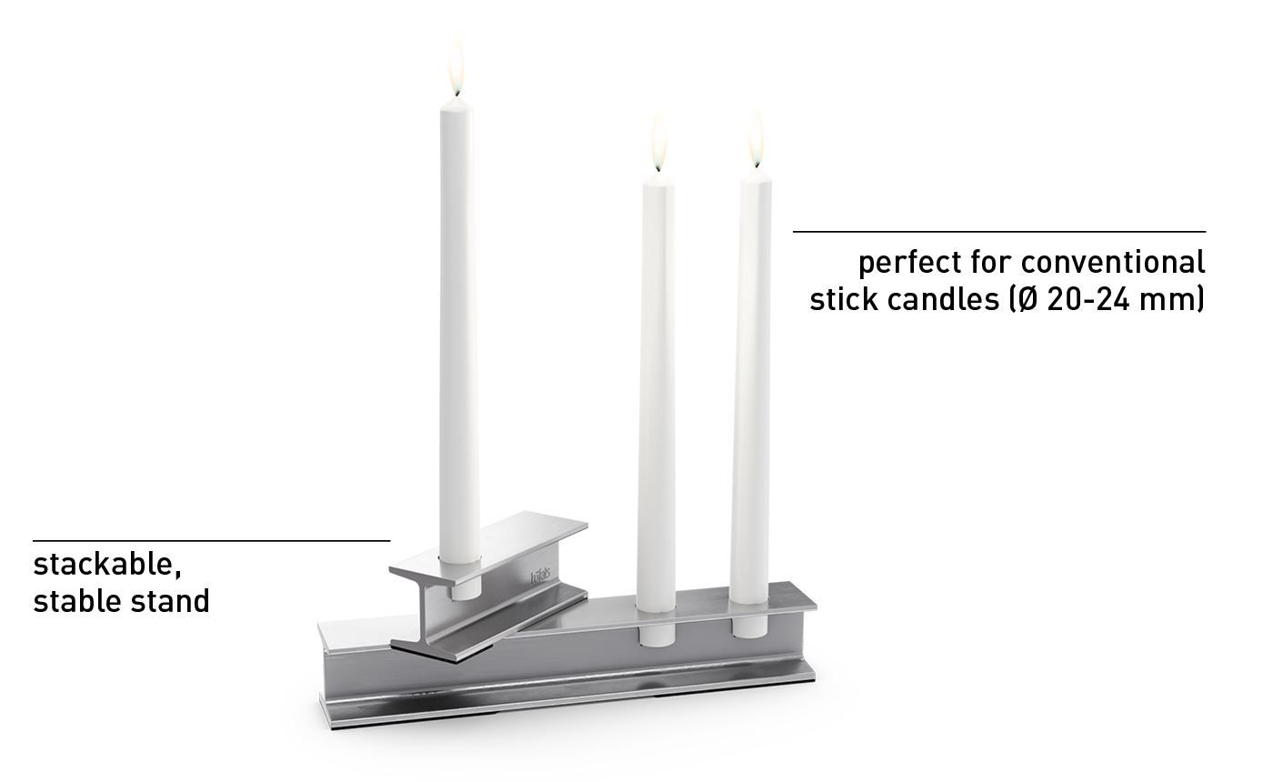 Illustrated is a white candle holder with two candles on it
