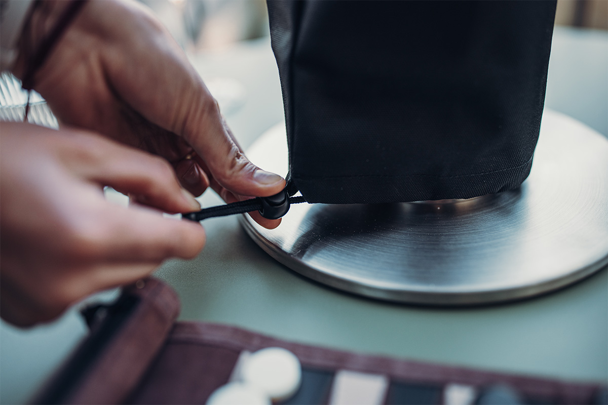 SPIN 900 Cover An image showing a person cutting a piece of a knife, with the SPIN 1200 Cover.