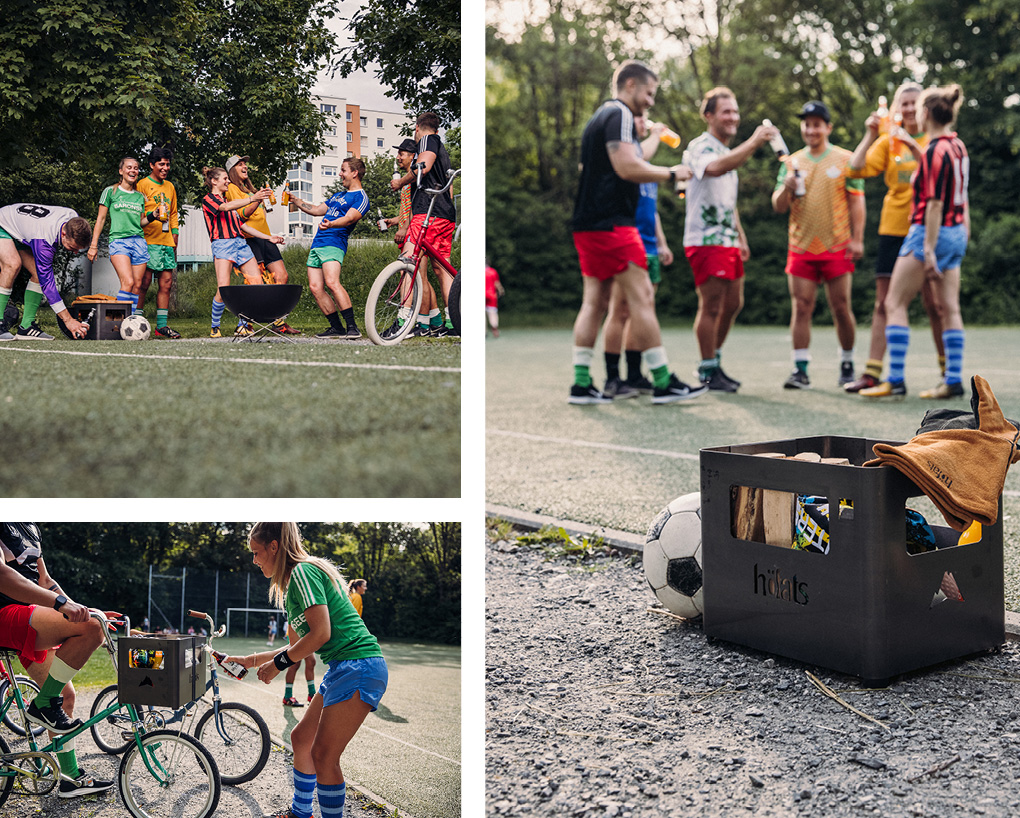 Das Foto zeigt eine Gruppe von Personen, die um eine Kiste herum stehen