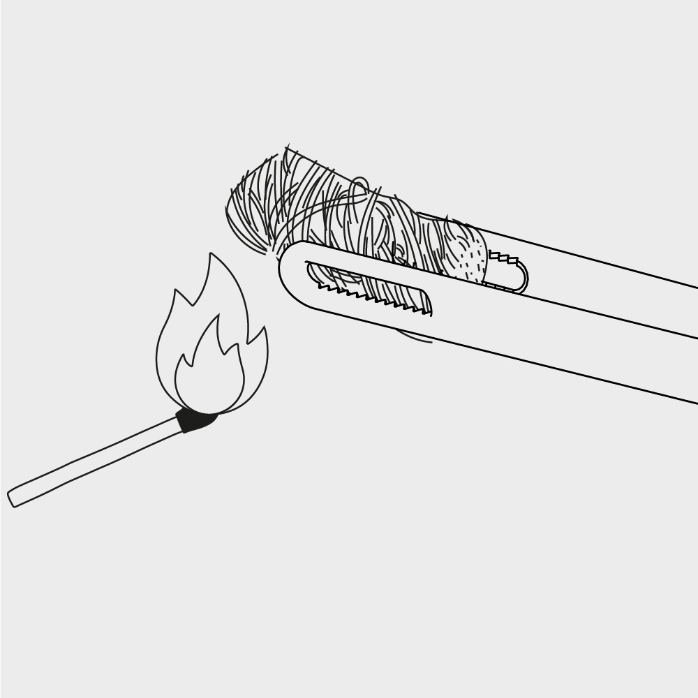 a drawing of how to put a burning fire starter into a grill