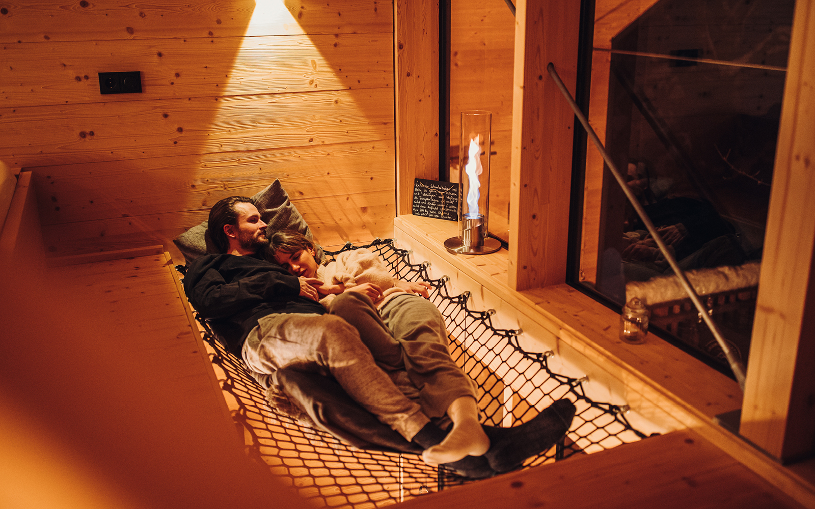 a man laying on a bed in a room