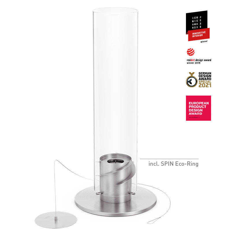 Une image montrant un tube en verre avec un support en métal, avec la cheminée sur pied SPIN 1500 en argent.
