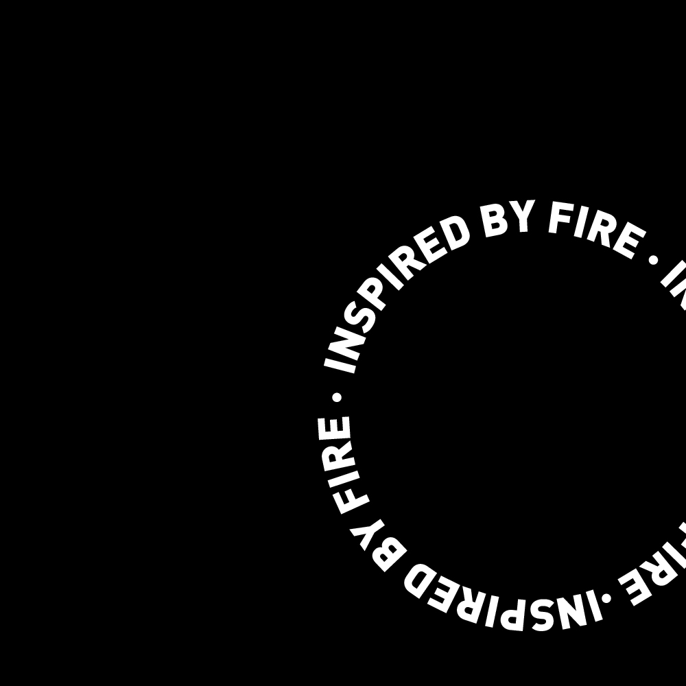 A black tile with circular alligned words „inspired by fire“