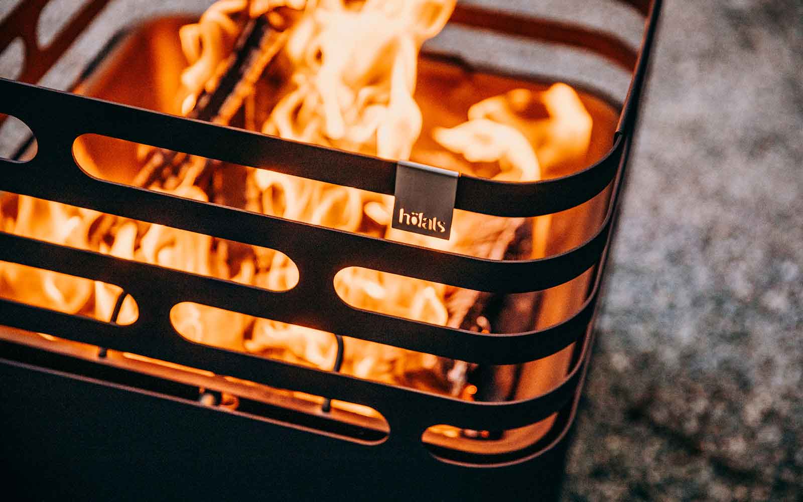 This image shows a fire in a metal container with a fire inside, with the discount total value of.