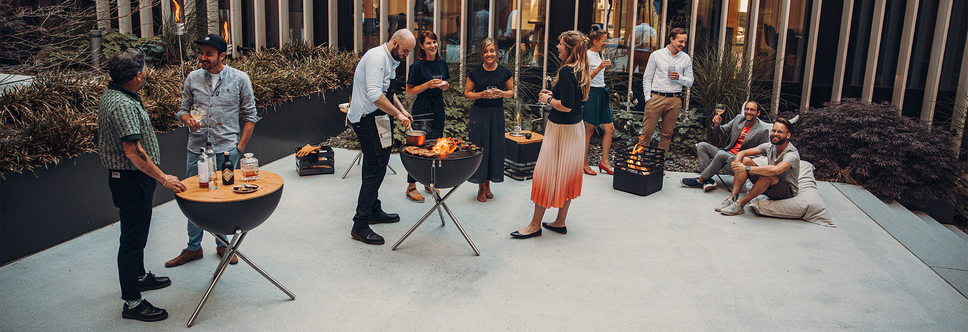 a group of people standing around a table.