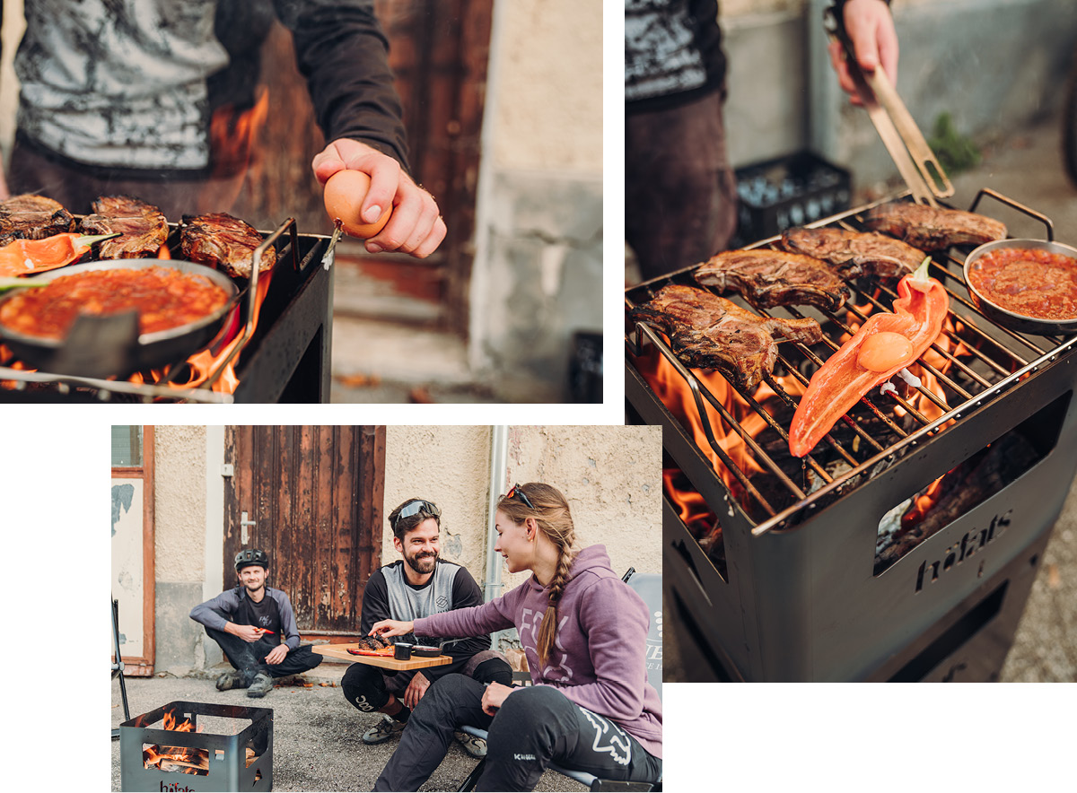 A view of a man and woman cooking food on a grill, with the BEER BOX Fire Basket.