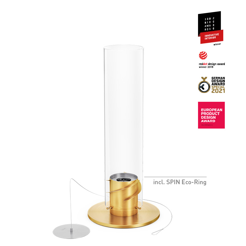 Une vue du cylindre en verre doré et blanc avec une base dorée, avec la cheminée de table SPIN 1200 en or.