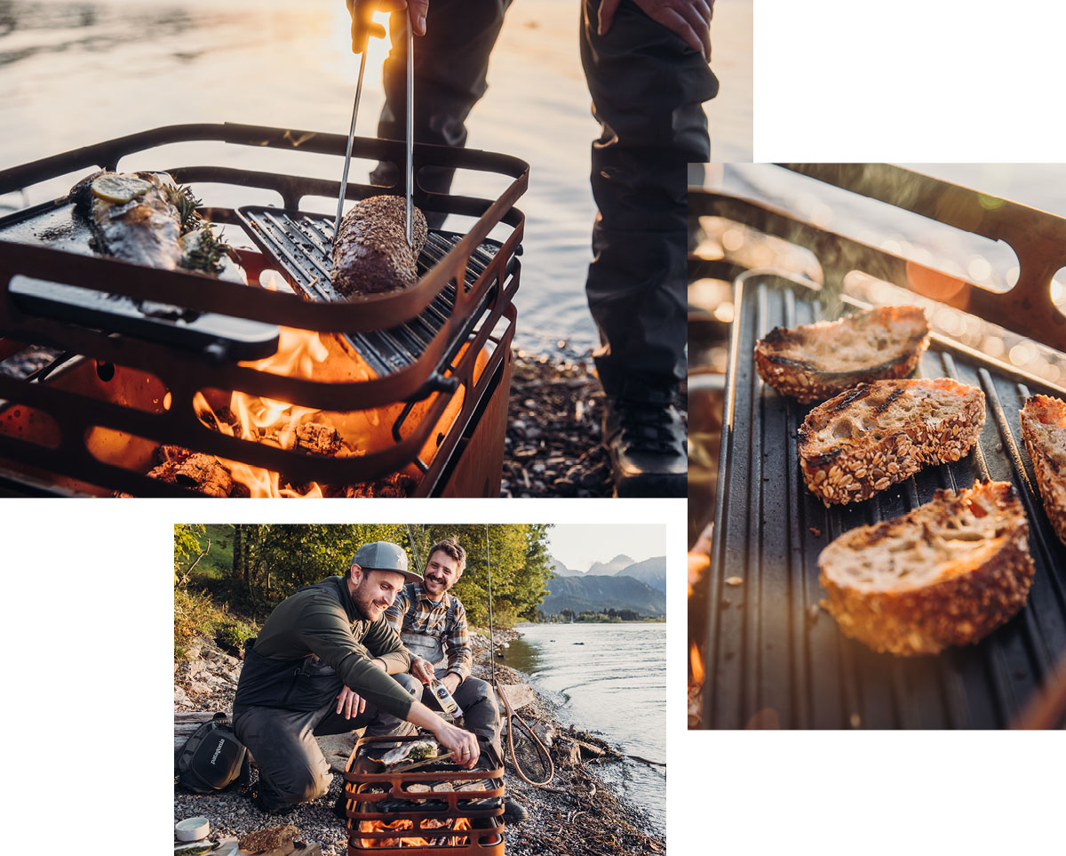 A view of a man cooking food on a grill on a lake