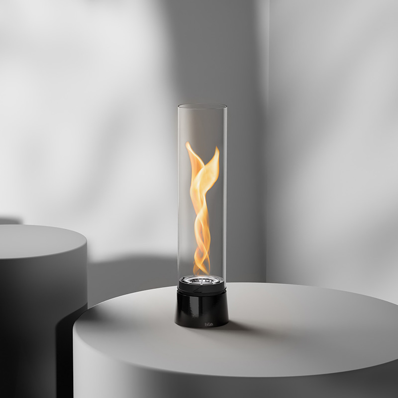 An inviting scene with a fire is lit on a table, highlighted by the presence of the 00776 Spin Air 900 Tablefire Emaille black
